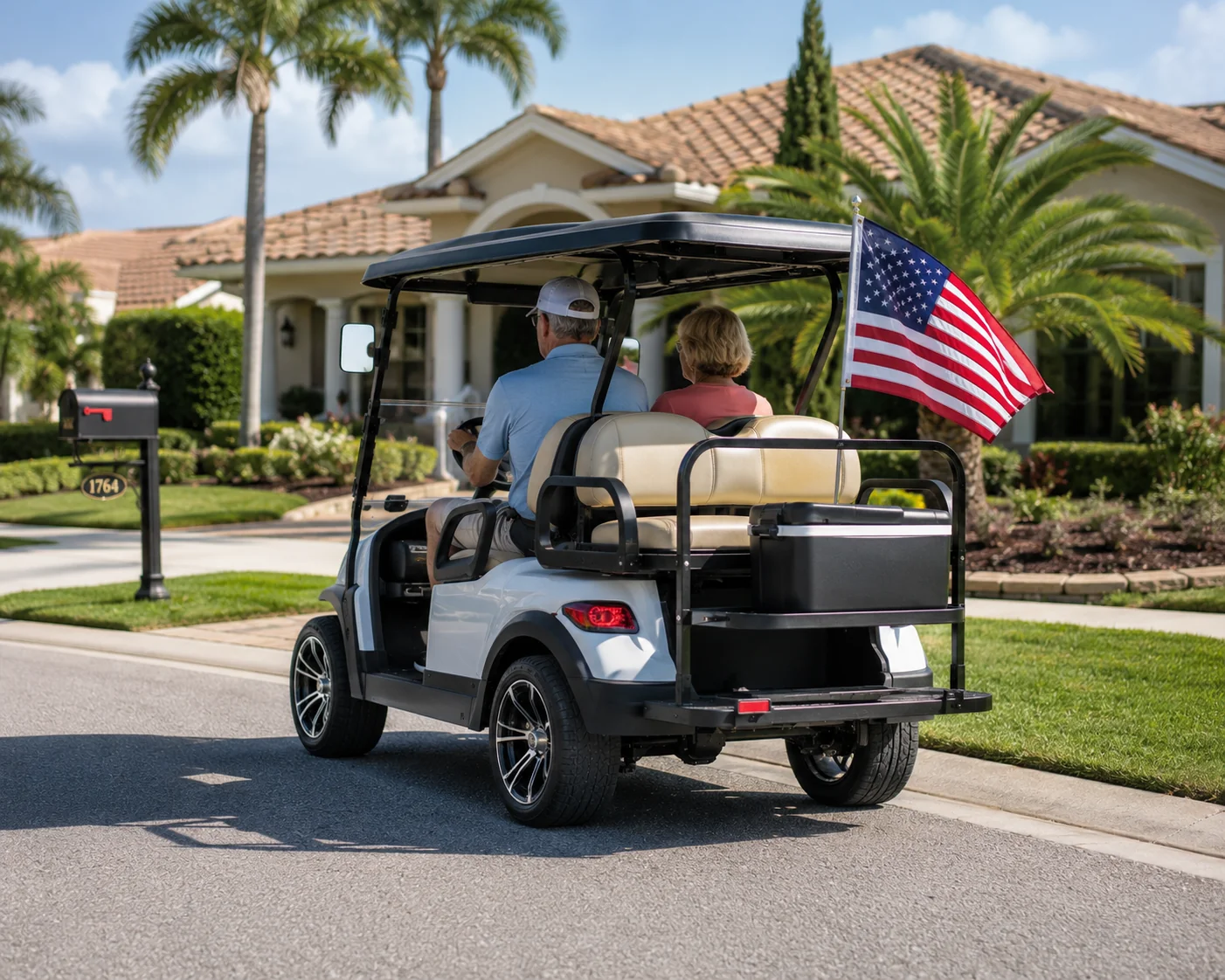 Custom golf cart with American flag in The Villages residential driveway setting.